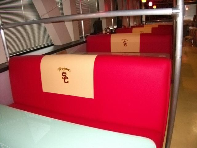 Commercial booth seating with an embroidered logo