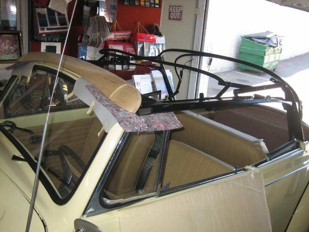 Preparing to install a convertible top on a Volkswagen Bug
